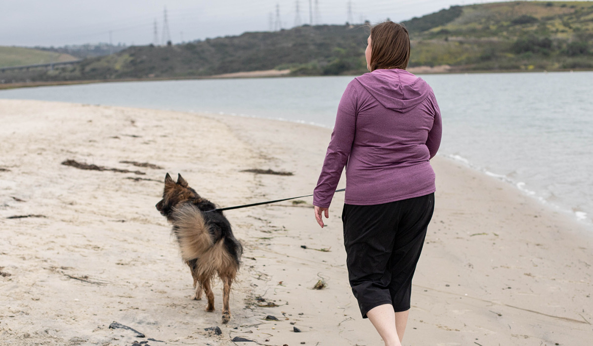 Woman walking her dog at the lagoon