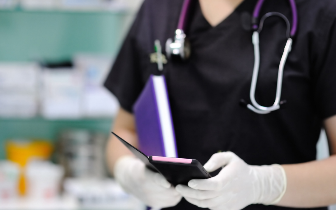 Close up of a veterinarian using their smartphone while wearing gloves