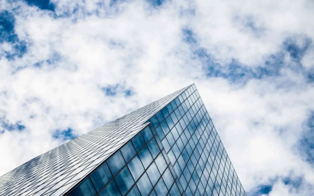 An upward shot of a building with a blue sky