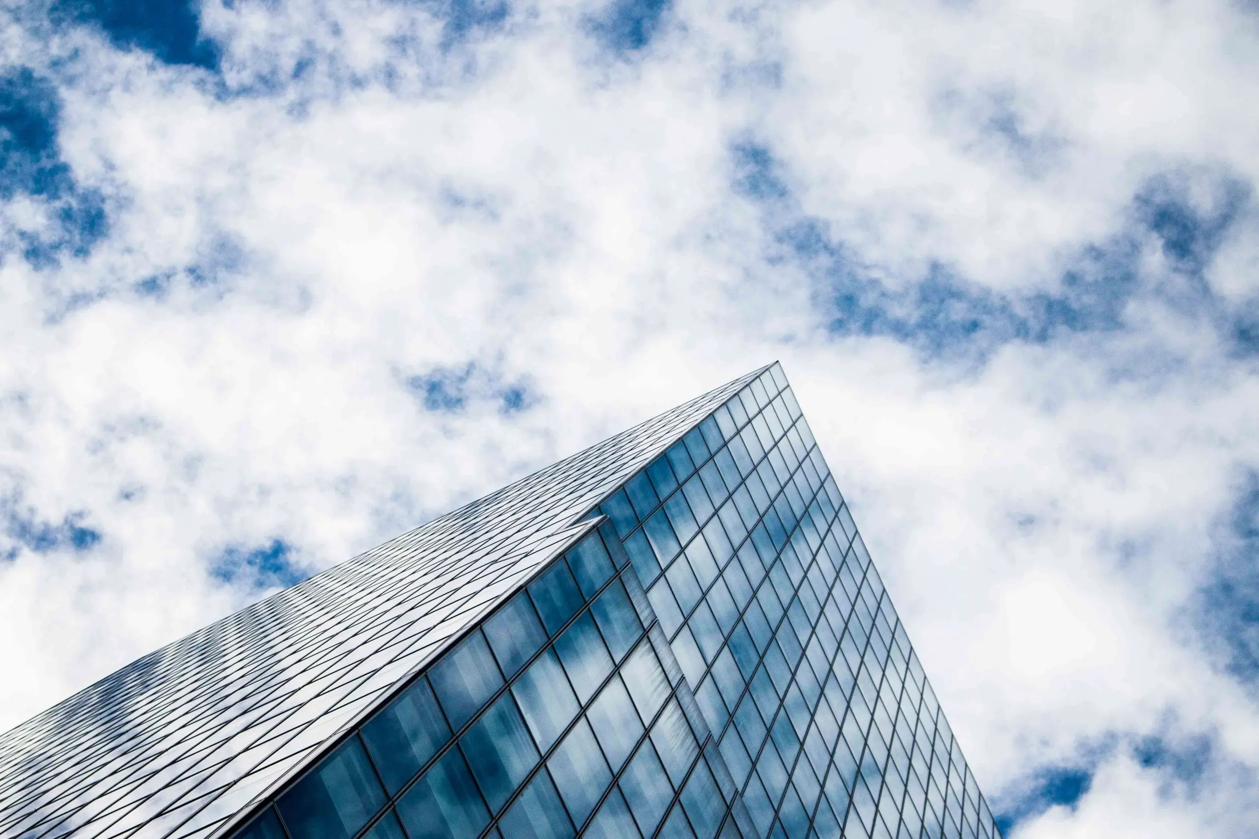 An upward shot of a building with a blue sky