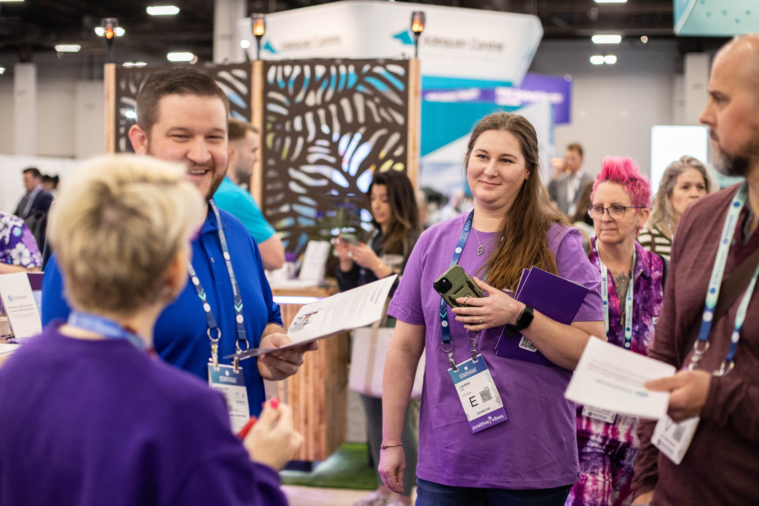 Group of Veterinarians and PetDesk employees happily chatting