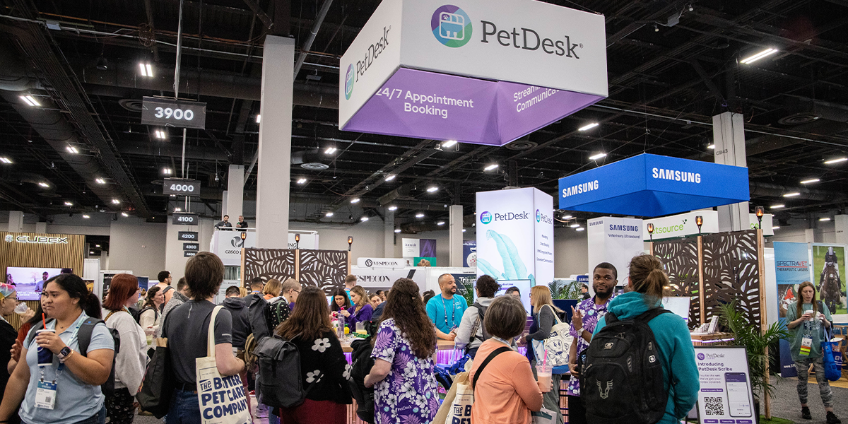AVMA-2025 Big group gathering at the PetDesk Booth at a convention
